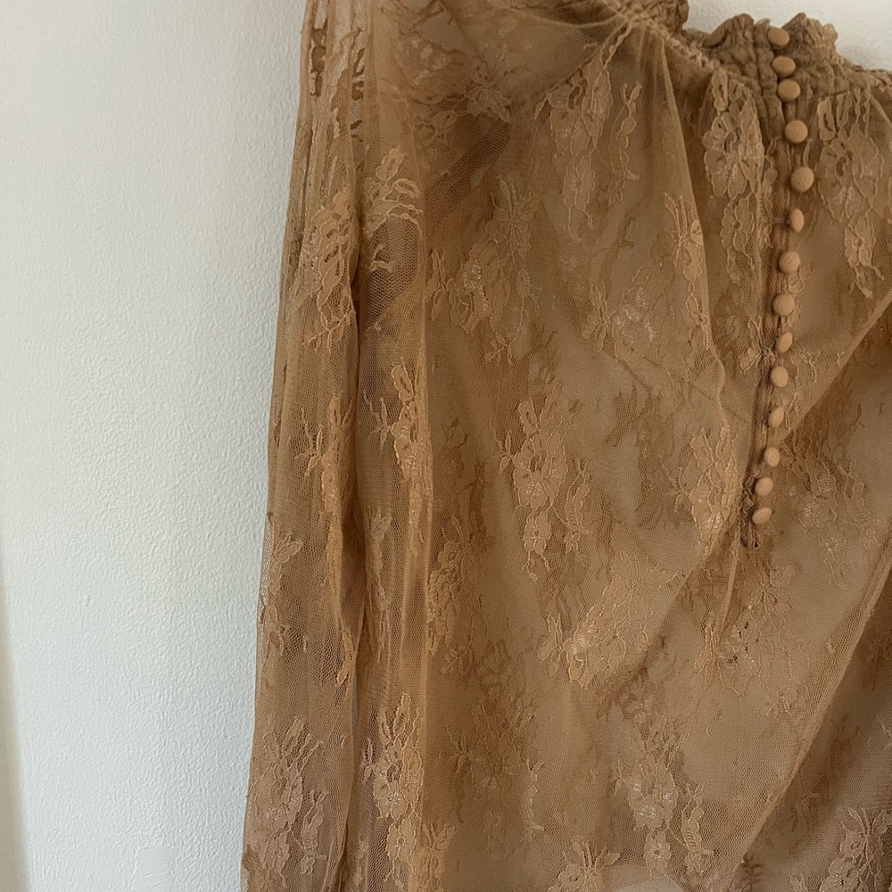 Sheer top with floral design